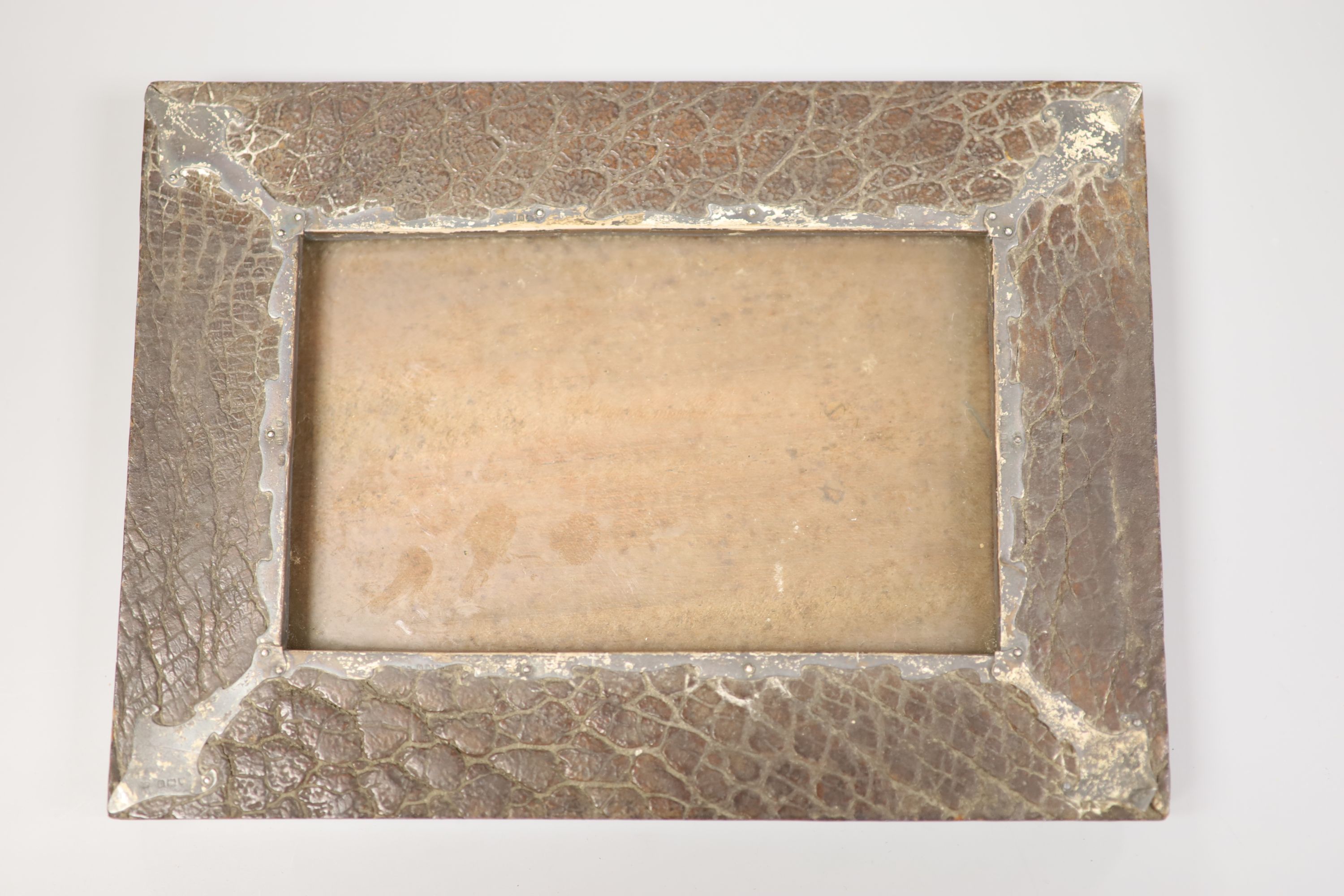 A silver-mounted rhino or elephant hide photo frame